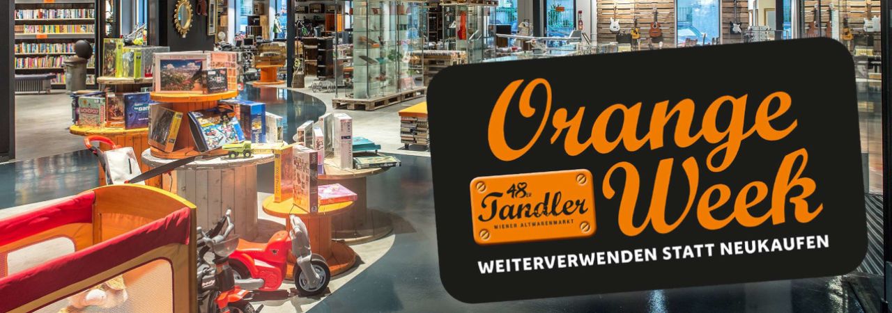 Sortiment des 48er Tandlers mit Schild zur Ankündigung der 'Orange Week'